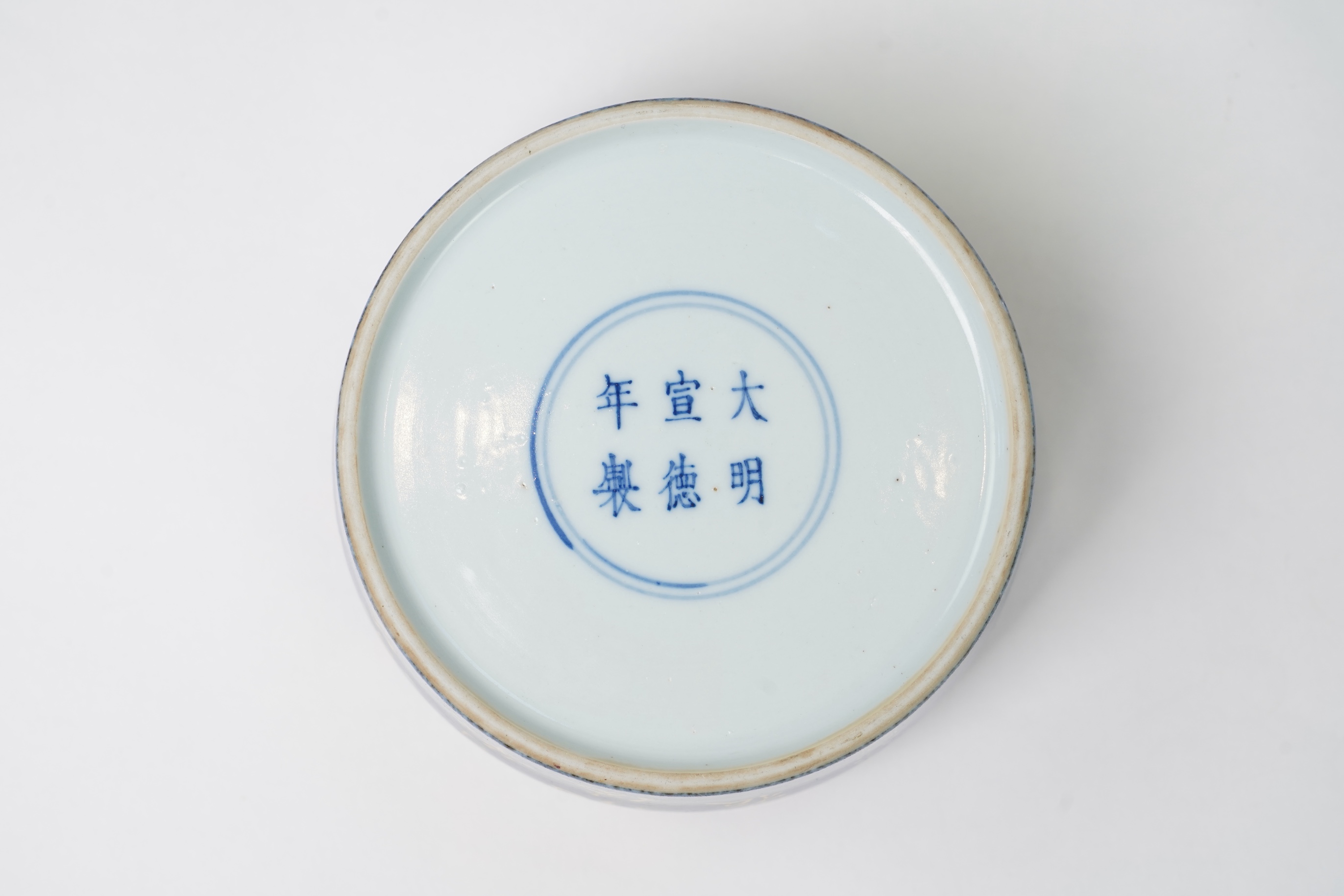 A Chinese gilt-decorated powder blue ‘fighting cricket’ box and cover, Xuande six character mark but later